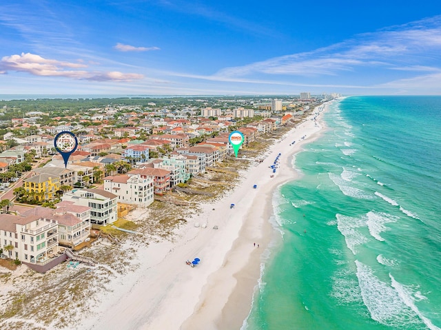 bird's eye view with a water view and a beach view