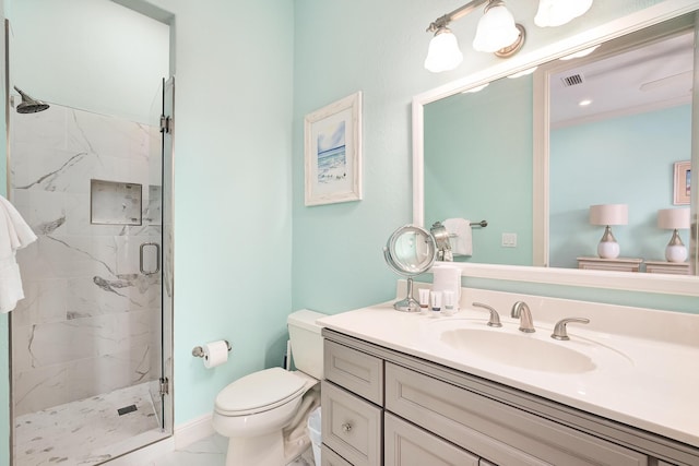 bathroom featuring toilet, vanity, and walk in shower