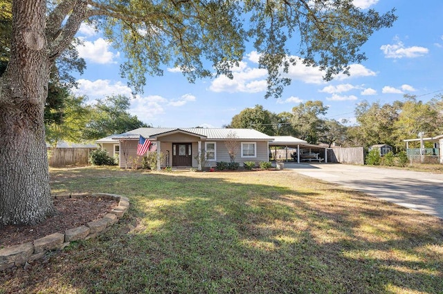 single story home with a carport and a front yard