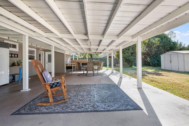 view of patio featuring a shed