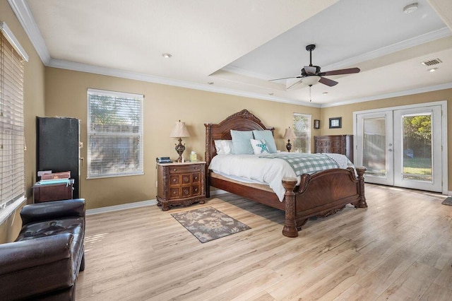 bedroom with access to outside, multiple windows, ceiling fan, and light hardwood / wood-style flooring