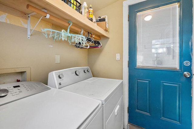 clothes washing area featuring independent washer and dryer