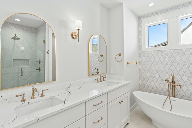 bathroom featuring separate shower and tub, tile patterned floors, and vanity