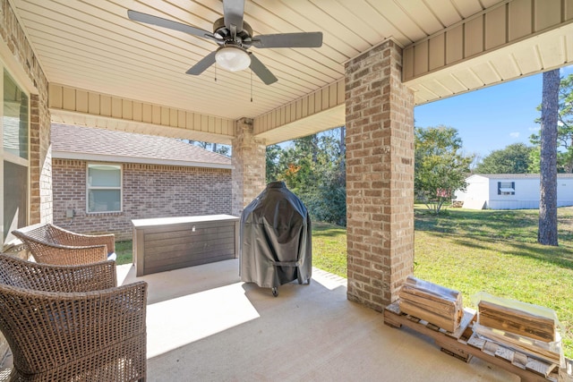 view of patio with ceiling fan and grilling area