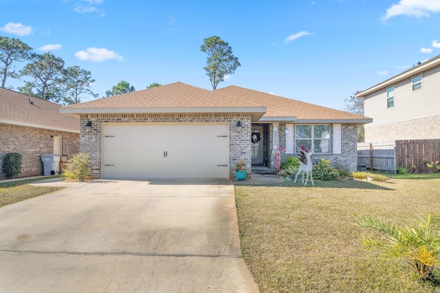 single story home with a garage and a front yard