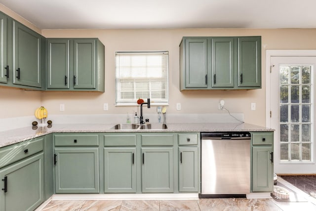 kitchen featuring green cabinets, dishwasher, plenty of natural light, and sink