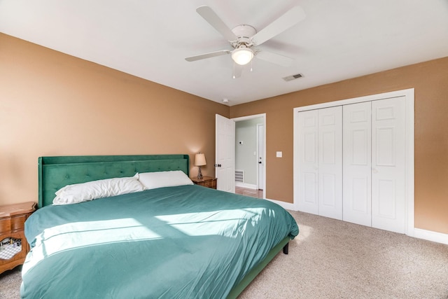 bedroom with carpet floors, a closet, and ceiling fan