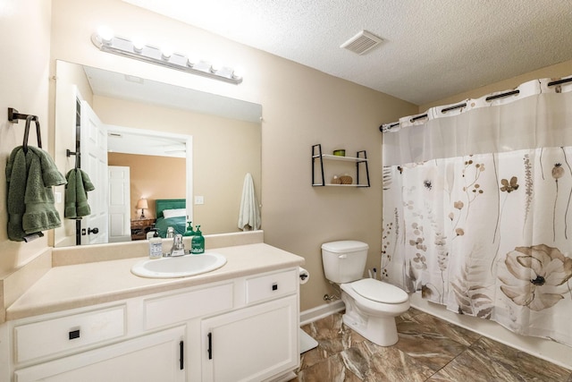 bathroom featuring vanity, curtained shower, toilet, and a textured ceiling