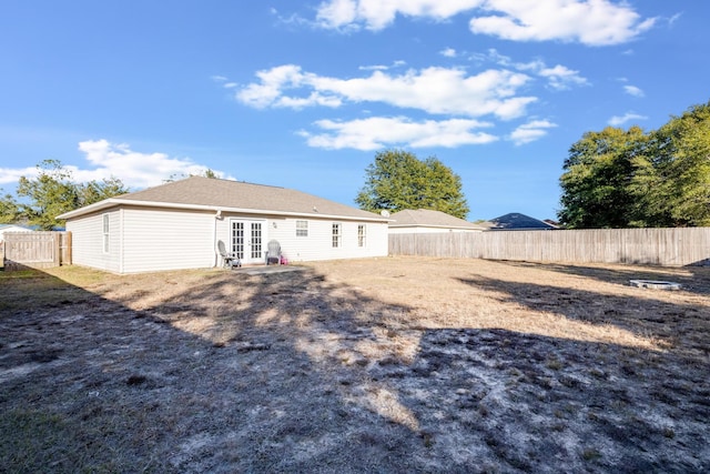 back of property featuring french doors