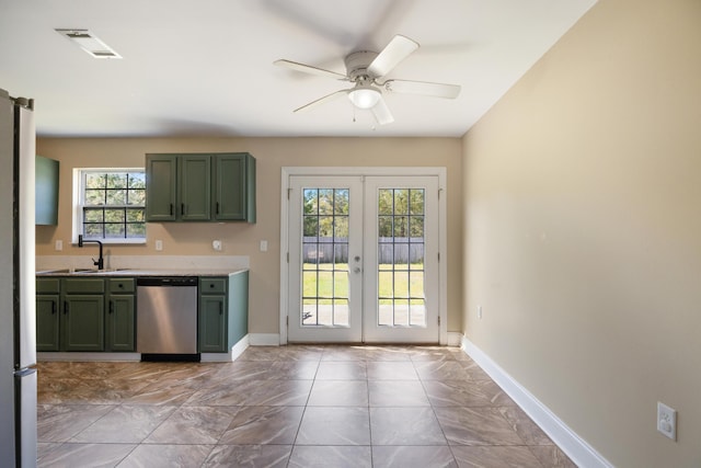 kitchen with green cabinets, stainless steel appliances, french doors, and visible vents