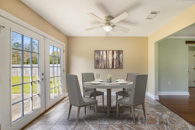 dining room with plenty of natural light, baseboards, visible vents, and french doors