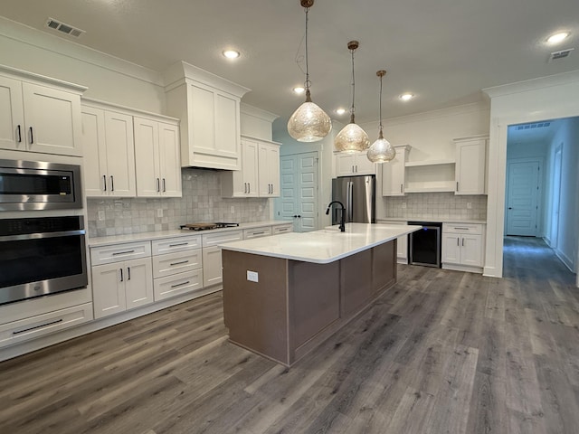 kitchen featuring visible vents, white cabinetry, ornamental molding, appliances with stainless steel finishes, and open shelves