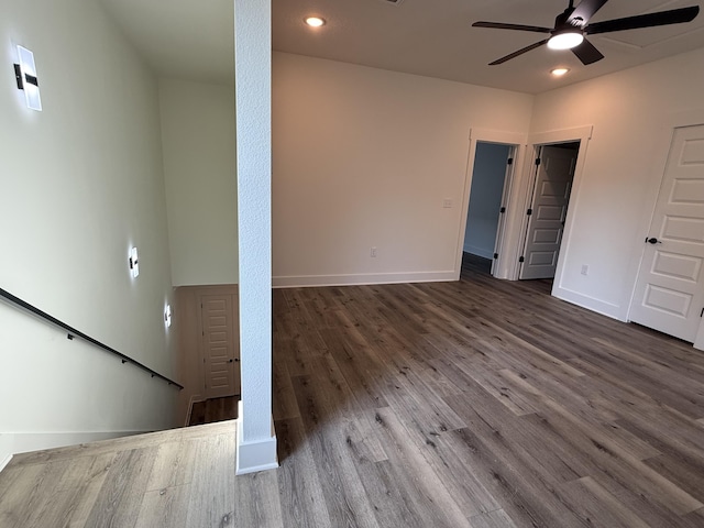 interior space with ceiling fan, baseboards, wood finished floors, and recessed lighting