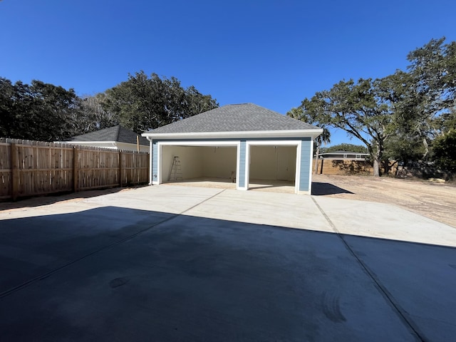 detached garage with fence