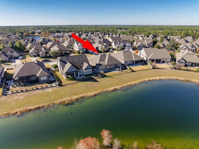 birds eye view of property featuring a water view