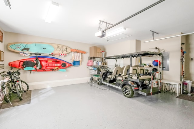 garage featuring electric panel and a garage door opener