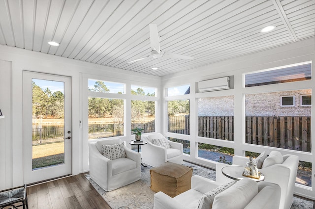 sunroom / solarium with a wall unit AC, ceiling fan, and wood ceiling