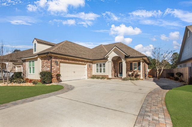 view of front facade featuring a garage and a front lawn