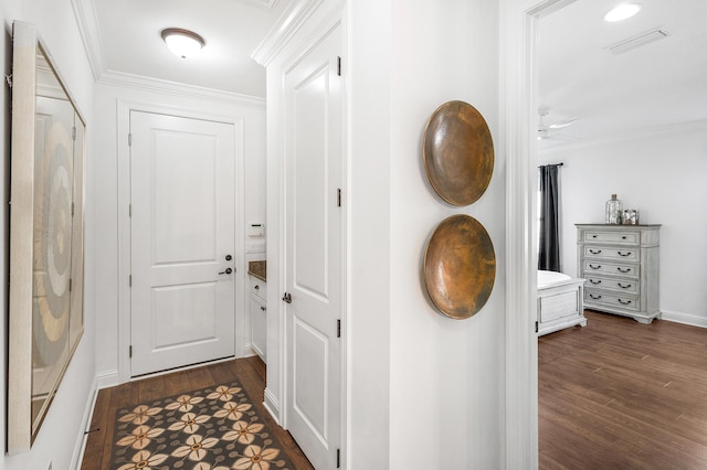 hall featuring dark hardwood / wood-style flooring and crown molding