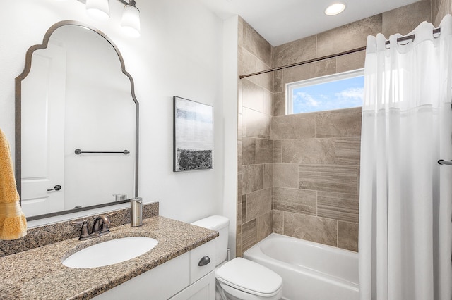 full bathroom with shower / tub combo with curtain, vanity, and toilet