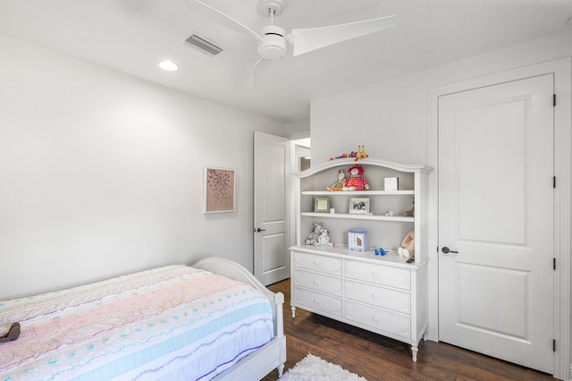 bedroom featuring dark hardwood / wood-style flooring and ceiling fan