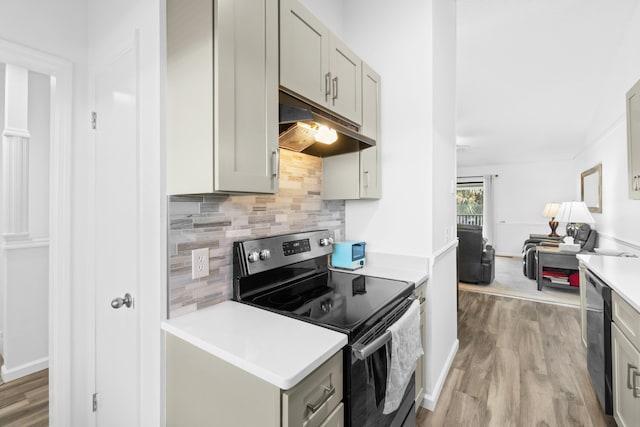 kitchen with gray cabinets, backsplash, appliances with stainless steel finishes, and light hardwood / wood-style flooring