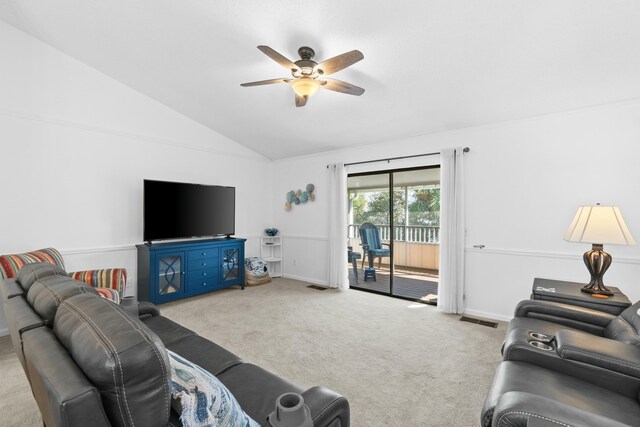 living room with ceiling fan, light colored carpet, and lofted ceiling