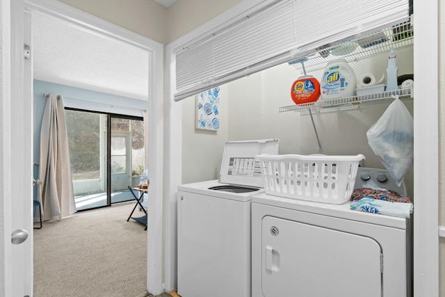 washroom with washer and clothes dryer and carpet floors