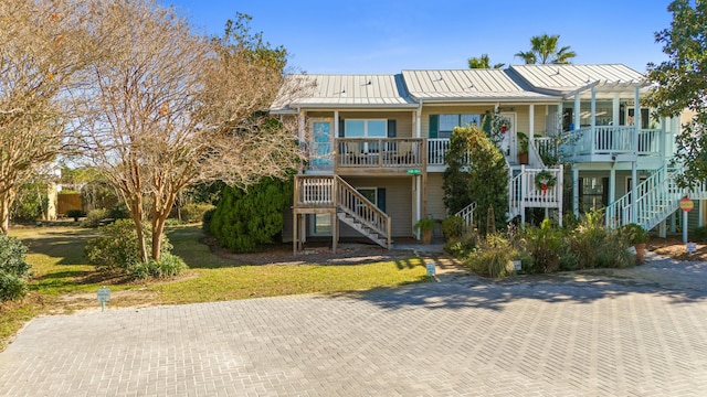 view of front of property with covered porch and a pergola