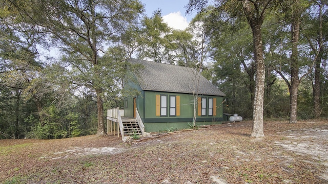 view of side of home featuring a deck