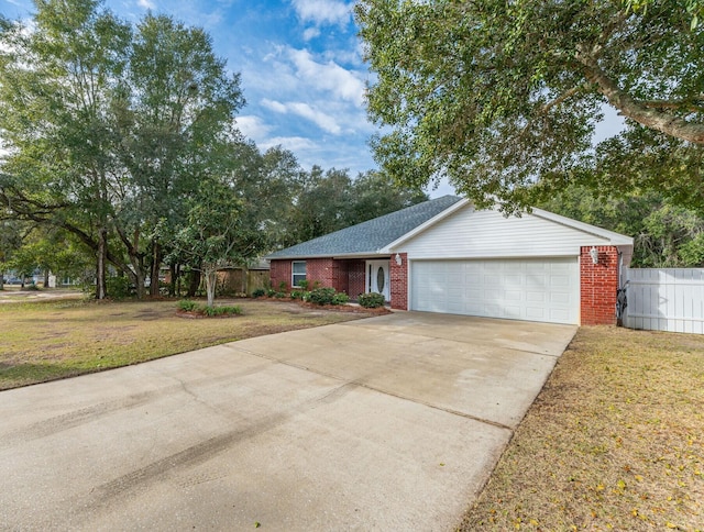 single story home featuring a front yard and a garage