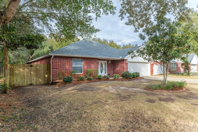 ranch-style house with a front yard and a garage