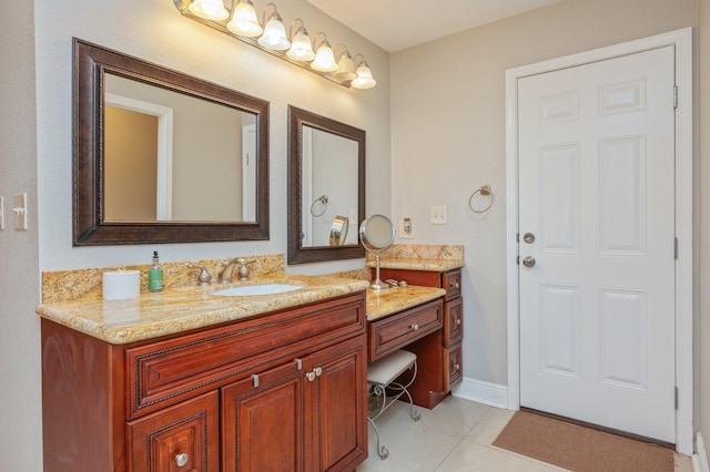 bathroom with tile patterned flooring and vanity