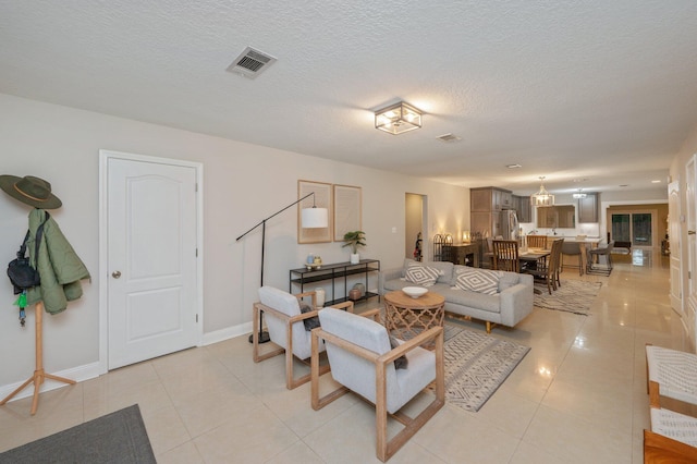 tiled living room with a textured ceiling