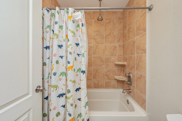 bathroom with shower / bath combo