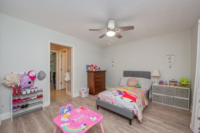 bedroom featuring ceiling fan and light hardwood / wood-style flooring