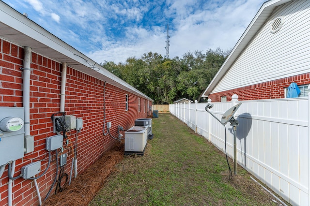 view of yard with central AC