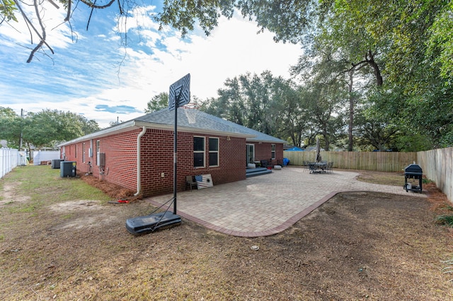 view of home's exterior with central AC and a patio