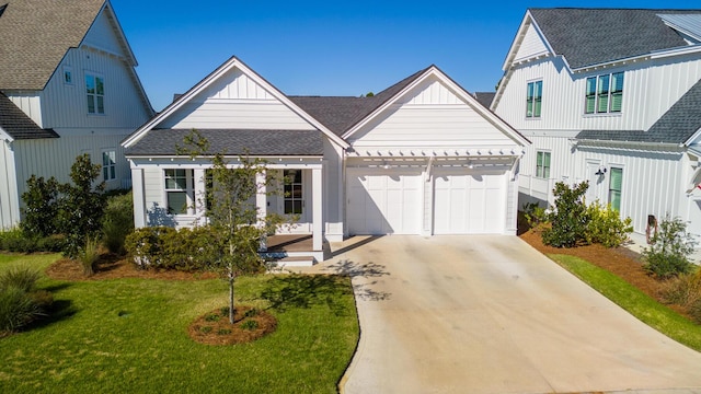 view of front of home featuring a garage and a front lawn