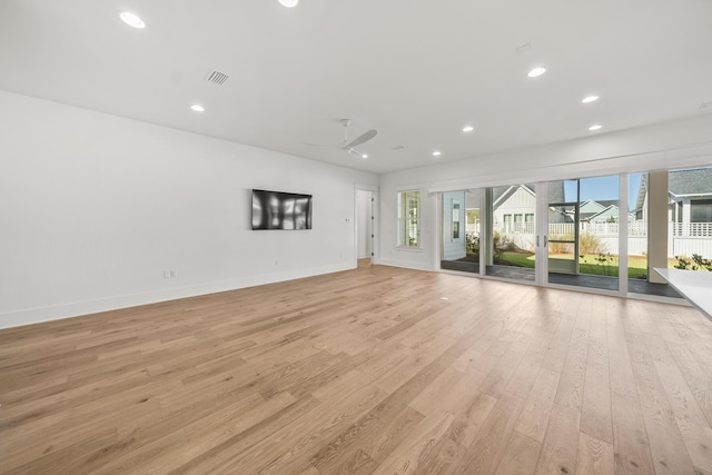 unfurnished living room featuring light hardwood / wood-style floors and ceiling fan