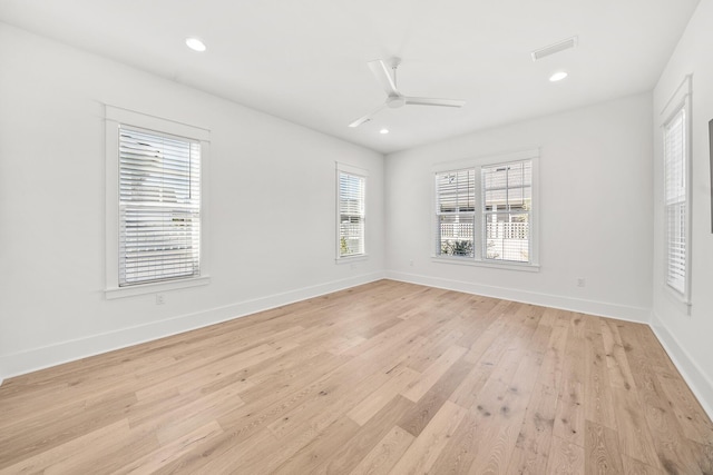 unfurnished room with ceiling fan and light hardwood / wood-style floors