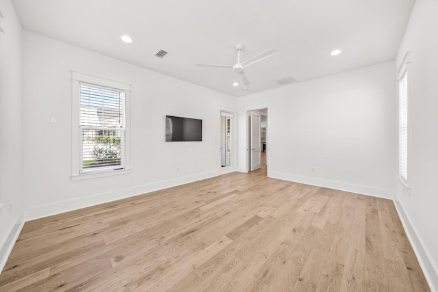 unfurnished room with ceiling fan and light hardwood / wood-style floors