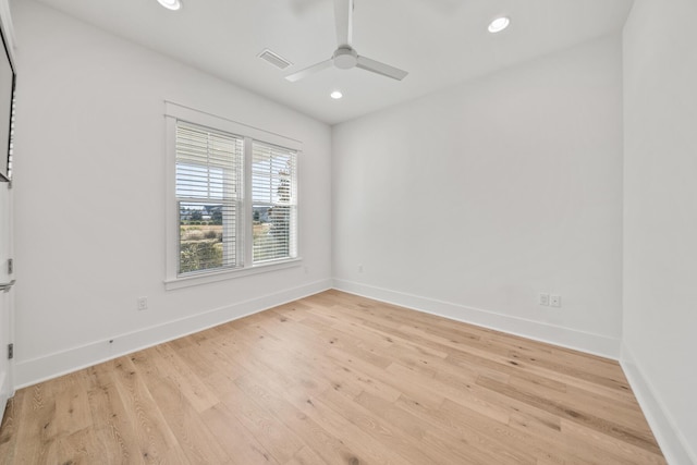 empty room featuring ceiling fan and light wood-type flooring