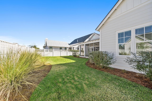 view of yard featuring a sunroom