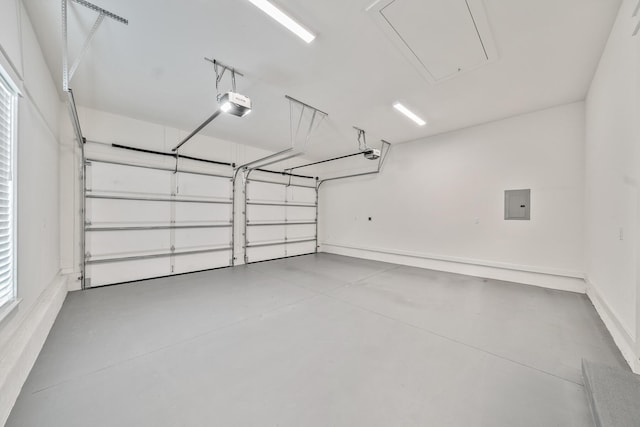 garage featuring electric panel and a garage door opener