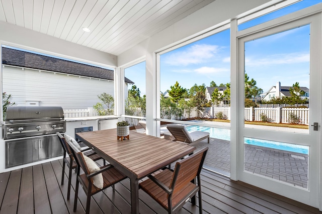 sunroom featuring wooden ceiling