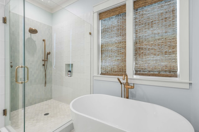 bathroom featuring shower with separate bathtub