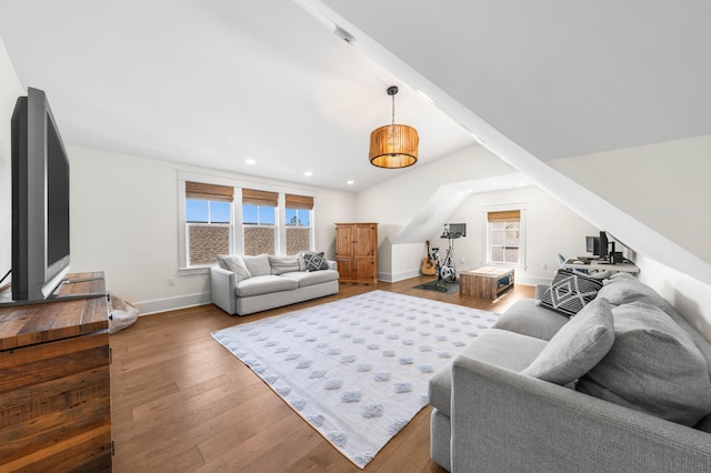 living area featuring recessed lighting, wood finished floors, baseboards, and a wealth of natural light