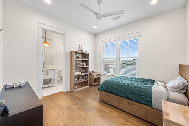 bedroom featuring a ceiling fan, visible vents, ensuite bath, recessed lighting, and light wood-type flooring