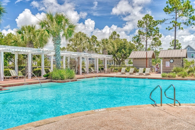 view of pool with a pergola and a patio area